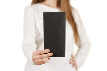 Girl showing blank black flyer brochure booklet. Leaflet present