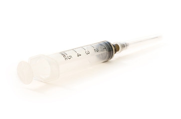 Medical syringe on white background