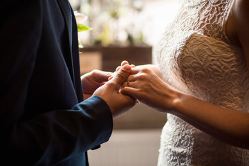 Obraz premium Wedding couple holding hands, bride and groom in love