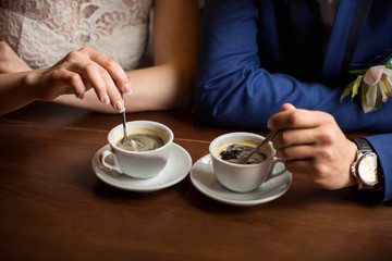 Cups of coffee for bride and groom at wedding day