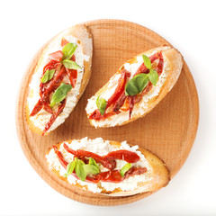 Italian sandwiches - bruschetta with cheese, tomato and basil. Top view