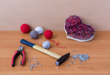 Tools for handiwork in stile String Art on wooden table