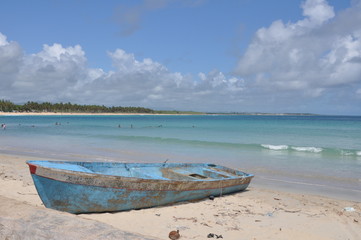 Old blue boat on the tropical beach with beautiful clear water