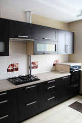 Kitchen furniture. Brown kitchen cabinets. Room design