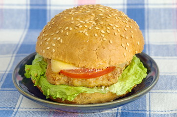 Hamburger with meat, cheese and vegetables