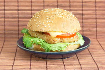 Hamburger with meat, cheese and vegetables