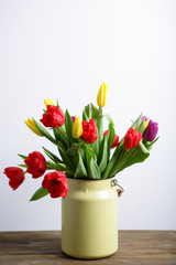 Spring flowers in a vase on a white background