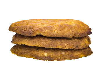 Three stack of oatmeal cookies on a white background