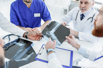 Thoughtful doctors having meeting in hospital