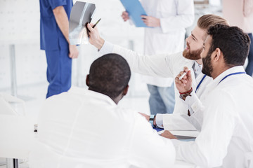 Outgoing medical advisers having meeting in hospital