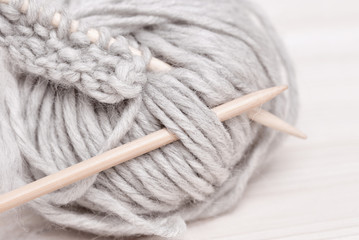 Incomplete knitting project with wooden needles