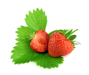 Red strawberry and half with leaves, isolated.
