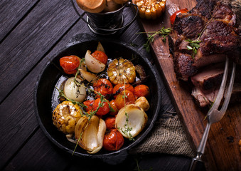 Delicious Grilled Steak sliced on a cutting board served with Gr
