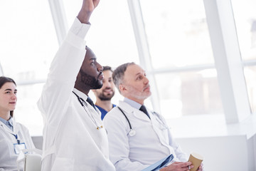 Obraz premium Serene physician sitting during meeting in clinic