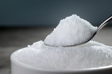 granulated sugar in silver spoon Empty ready for your product di