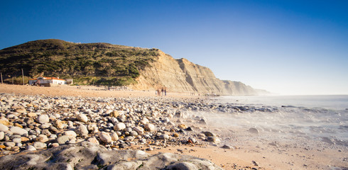 Fototapeta na wymiar Rocky coastal seascape in the Magoito beach in Portugal