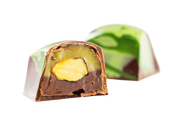 Cut chocolate candy with pistachio nut