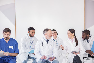 Therapeutics reclining on seats in hospital room