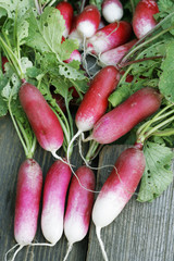 Long roots radishes on wood