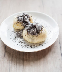 Traditional austrian czech yeast dumpling with poppy-seeds and sugar