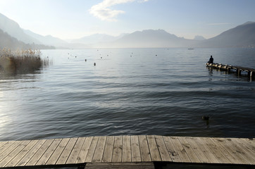 Man sitting on pontoon lake annecy