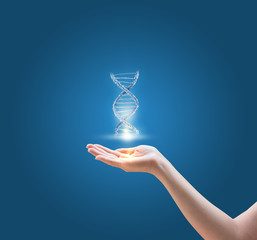 DNA molecules in hand on blue background.