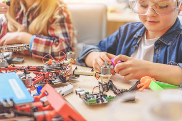 Curious children in light workshop