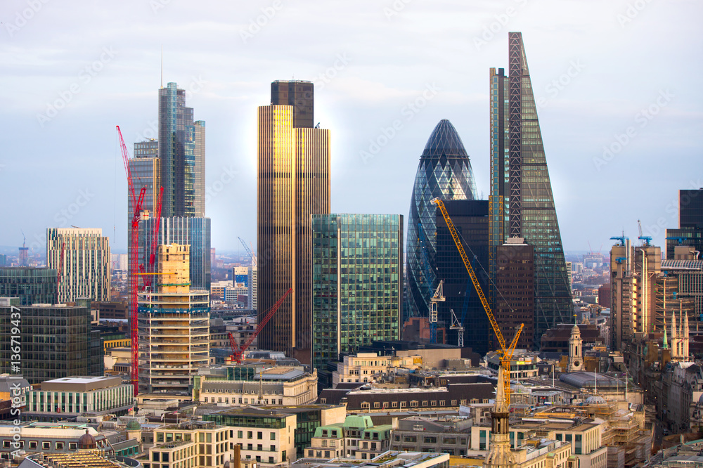 Sticker city of london business aria view at sunset. view includes gherkin and modern skyscrapers of leading