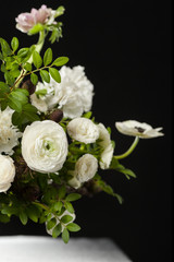 Flower composition on a black background. Bouquet from spring flowers. Wedding bouquet.