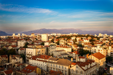 Fototapeta na wymiar View over the red roofs of houses, Split, Croatia, Dalmatia with Mosor mountain in background