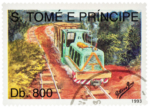 Raylway in the forest with small locomotive on postage stamp