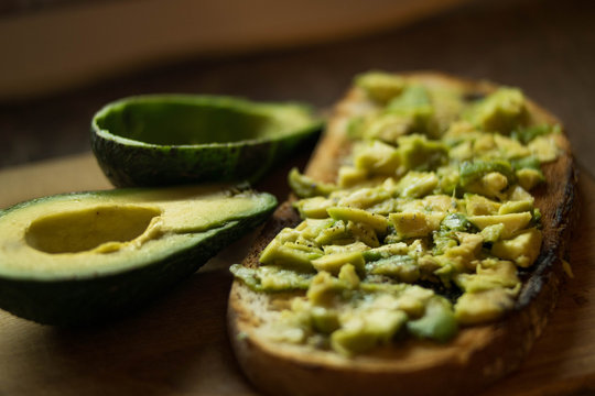 Healthy meal, avocado on toast with sprinkled black pepper.