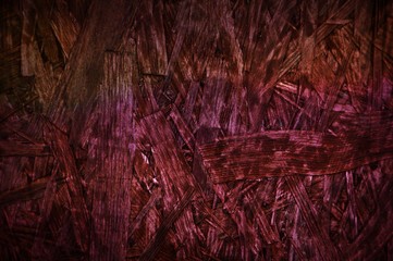 Burgundy red chipboard particle board desk surface wooden background texture