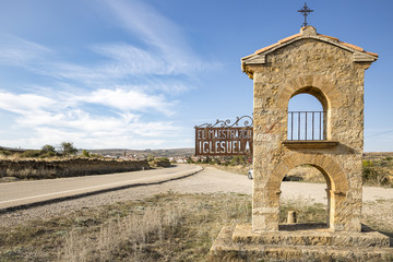 a medieval looking stone made signpost indicating El Maestrazgo Iglesuela (del Cid), province of...