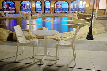 Night cafe near the pool. table for two