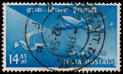 Stamp printed by India shows plane and pigeon
