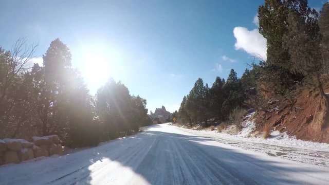 Time-lapse. POV point of view - Driving through Garden of the Gods on late morning in the Winter