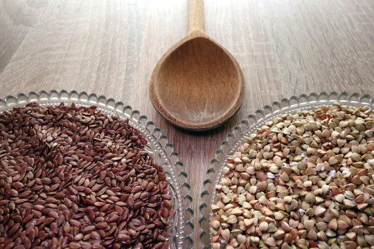 Flax seeds and buckwheat groats on rustic table, healthy diet concept © piter2121