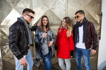 Group of cheerful young friends is having good time together
