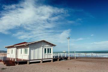 Fototapeta na wymiar Small white cottage by the sea