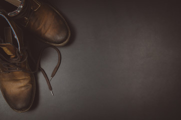 Accessories for travel top view on black chalkboard background with copy space. Adventure and wanderlust concept image with travel accessories. Preparing for an exotic trip, journey and sightseeing.