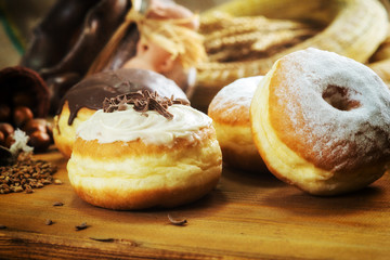 Close up. Beautifully arranged delicious doughnuts with icing, s