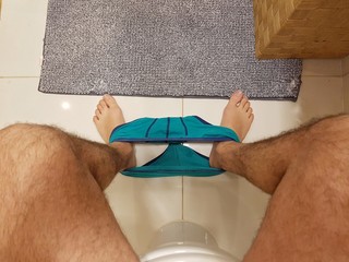 Up point of view of a man sitting in the toilet