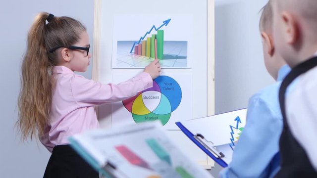Young children are considered charts in the hands of the boys with the documents folder