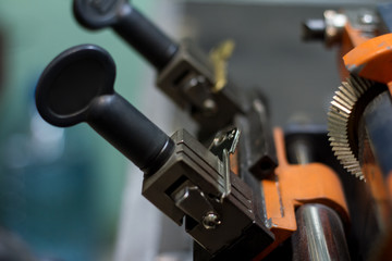 Fototapeta na wymiar Machine production of duplicate metal key.