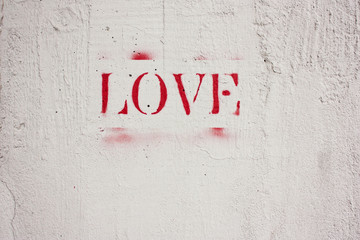 The word love written in red letters