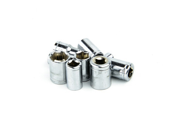 A set of metal heads for keys of different sizes isolated on a white background. The iron heads of the keys.