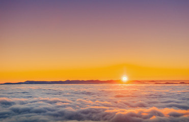 fog in winter mountains. Fantastic sunset.