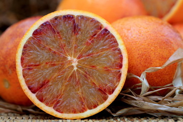Blood oranges on the brown background