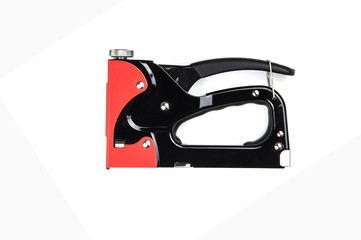 Red and Black metal stapler on white background